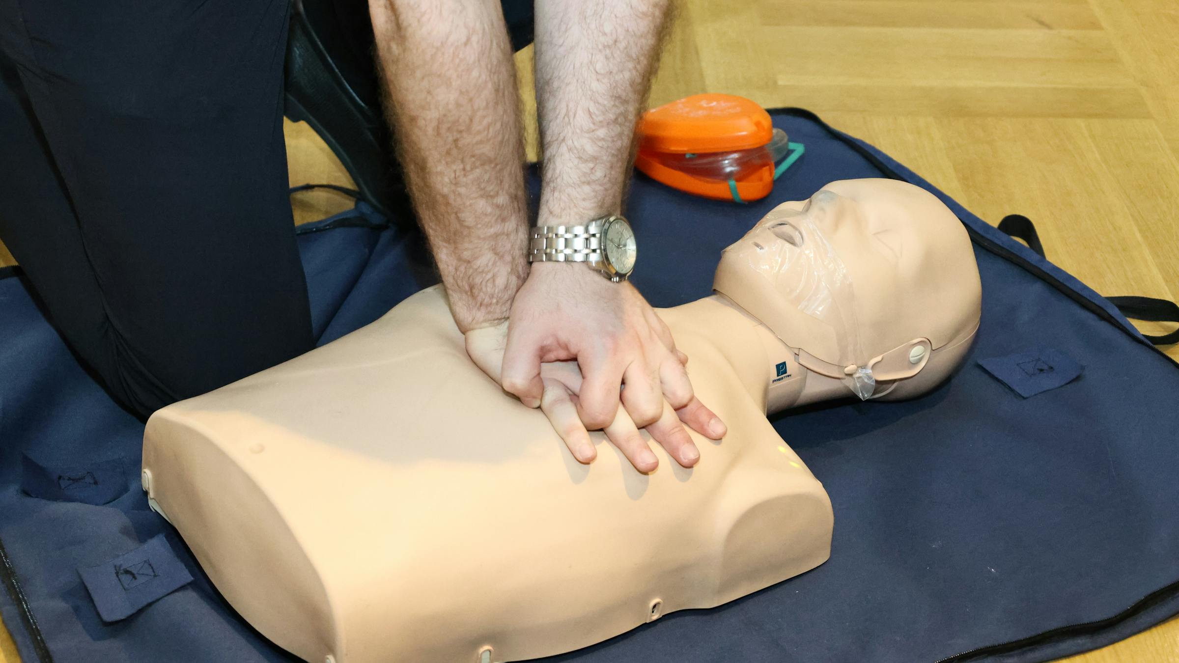 Classroom CPR practice on a training mannequin
